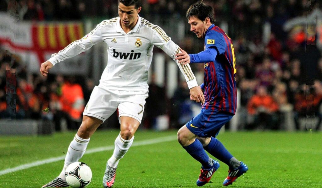 Messi Vs Ronaldo Football Playing Wallpaper